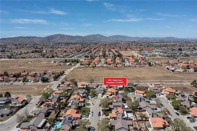 4231 Sage Ct, Palmdale, CA 93552 - aerial view of property and surrounding area with mountains and nearby suburban area