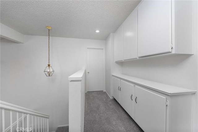 4231 Sage Ct, Palmdale, CA 93552 - laundry room featuring a textured ceiling, carpet flooring, and recessed lighting