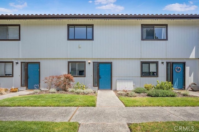 676 N 12th St Unit 21, Grover Beach, CA 93433 - view of front facade with a front lawn