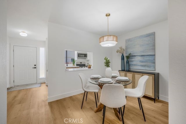 676 N 12th St Unit 21, Grover Beach, CA 93433 - dining room featuring light wood-style flooring and baseboards