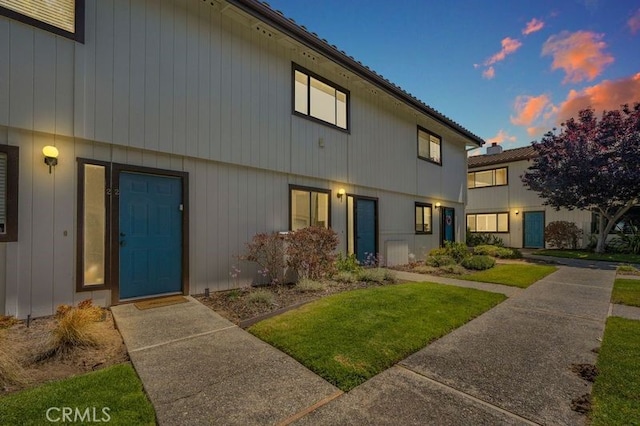 676 N 12th St Unit 21, Grover Beach, CA 93433 - view of front of house featuring a yard