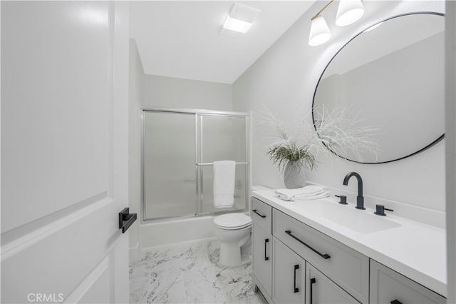 676 N 12th St Unit 21, Grover Beach, CA 93433 - bathroom with vanity, toilet, bath / shower combo with glass door, and marble look tiles