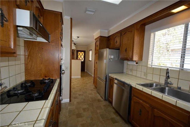 11514 Beverly Blvd, Whittier, CA 90601 - kitchen with tile countertops, appliances with stainless steel finishes, decorative backsplash, and crown molding