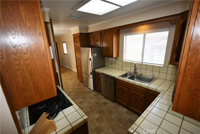 11514 Beverly Blvd, Whittier, CA 90601 - kitchen featuring tile countertops, dishwasher, freestanding refrigerator, crown molding, and tasteful backsplash
