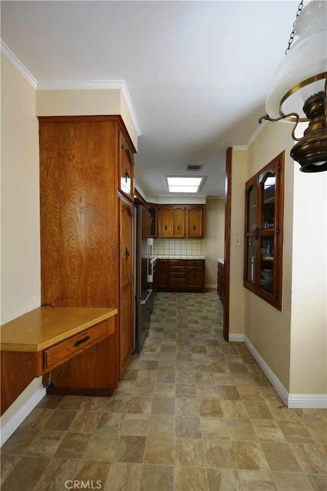 11514 Beverly Blvd, Whittier, CA 90601 - kitchen with high end refrigerator, stone finish floors, brown cabinets, decorative backsplash, and crown molding