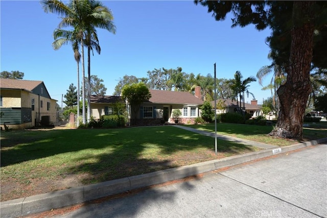 11514 Beverly Blvd, Whittier, CA 90601 - view of front of home with a front lawn and central AC
