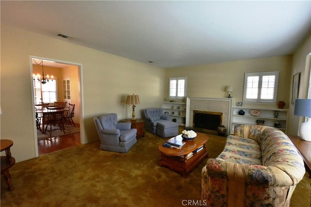 11514 Beverly Blvd, Whittier, CA 90601 - living area featuring a chandelier, plenty of natural light, and a fireplace