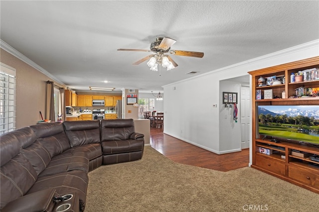 38701 Annette Ave, Palmdale, CA 93551 - living room featuring ornamental molding, ceiling fan, dark carpet, dark wood-style floors, and baseboards