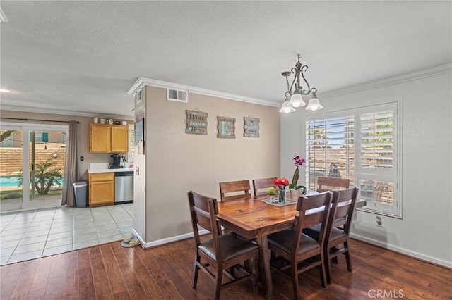38701 Annette Ave, Palmdale, CA 93551 - dining room with crown molding, baseboards, wood finished floors, and a textured ceiling