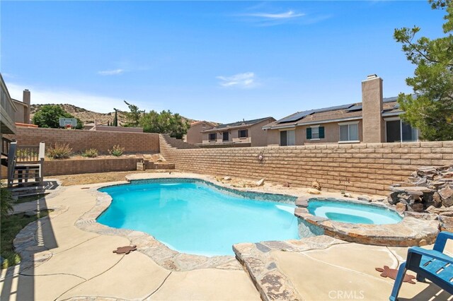 38701 Annette Ave, Palmdale, CA 93551 - view of swimming pool featuring a fenced backyard and a pool with connected hot tub