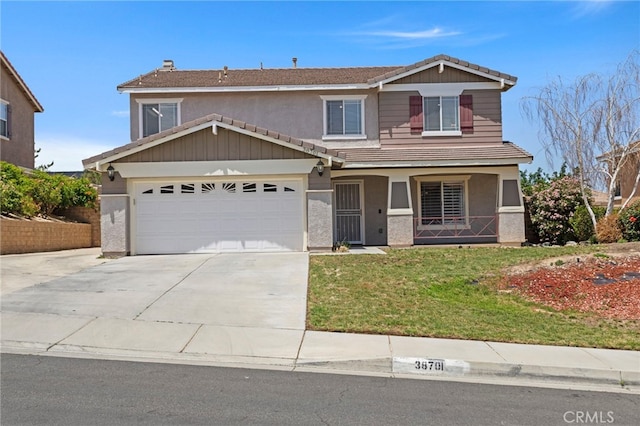 38701 Annette Ave, Palmdale, CA 93551 - view of front of property with driveway, a front yard, a porch, a tile roof, and stucco siding