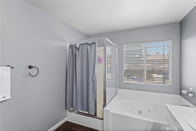 38701 Annette Ave, Palmdale, CA 93551 - full bathroom with a stall shower, a whirlpool tub, a textured ceiling, and baseboards