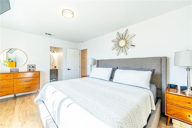 7017 Filkins Ave, Rancho Cucamonga, CA 91701 - bedroom featuring light wood-type flooring and ensuite bath