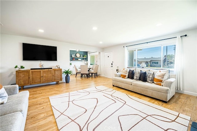 7017 Filkins Ave, Rancho Cucamonga, CA 91701 - living area featuring light wood finished floors and recessed lighting