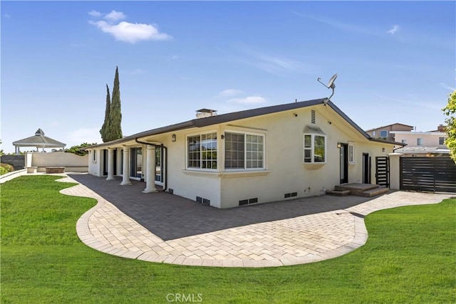 4508 Don Timoteo Dr, Los Angeles, CA 90008 - back of house featuring stucco siding, a patio area, and a chimney