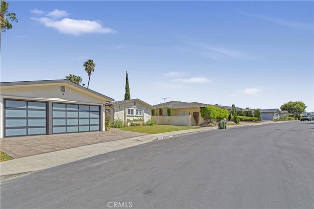 4508 Don Timoteo Dr, Los Angeles, CA 90008 - view of front of house with a garage, stucco siding, and driveway