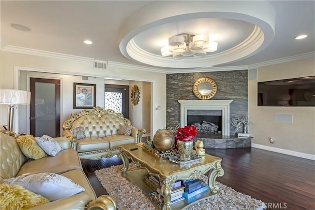 4508 Don Timoteo Dr, Los Angeles, CA 90008 - living room with a tray ceiling, ornamental molding, wood finished floors, recessed lighting, and a fireplace
