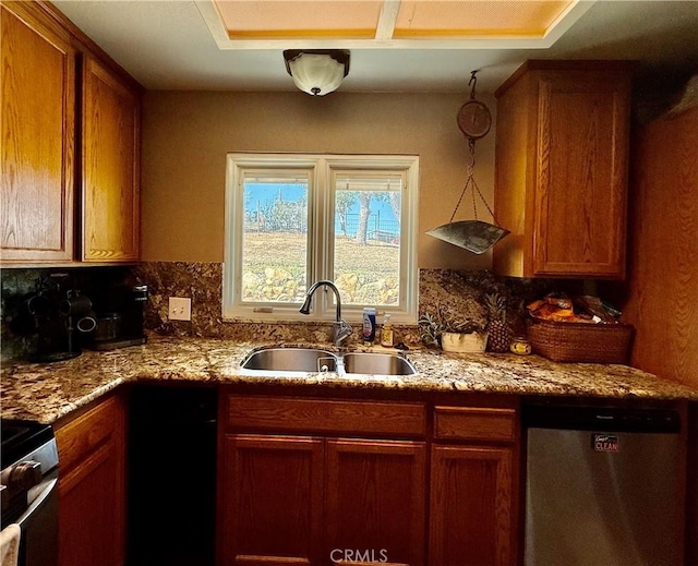 9307 Banderilla Dr, La Grange, CA 95329 - kitchen featuring appliances with stainless steel finishes, a sink, backsplash, and brown cabinetry