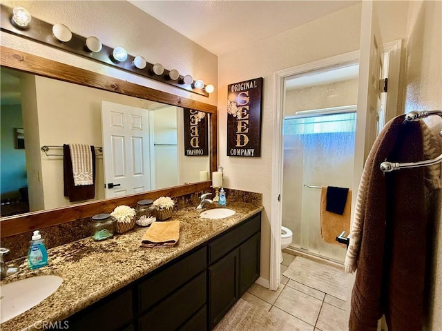 9307 Banderilla Dr, La Grange, CA 95329 - full bath featuring toilet, double vanity, a stall shower, and tile patterned floors