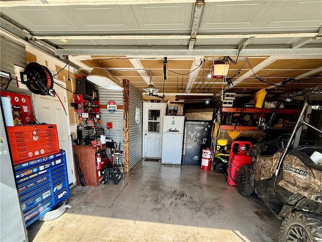 9307 Banderilla Dr, La Grange, CA 95329 - garage with a workshop area and freestanding refrigerator