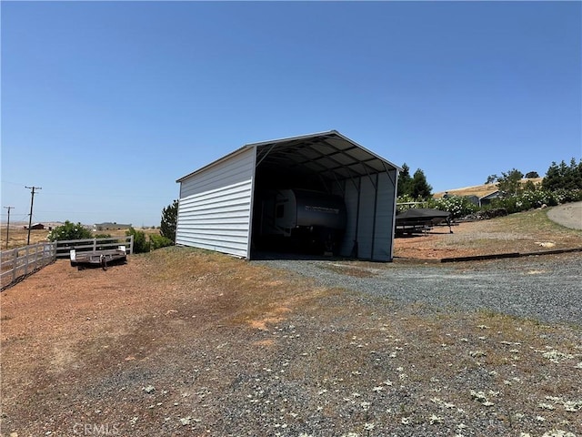 9307 Banderilla Dr, La Grange, CA 95329 - view of outdoor structure featuring dirt driveway and a carport
