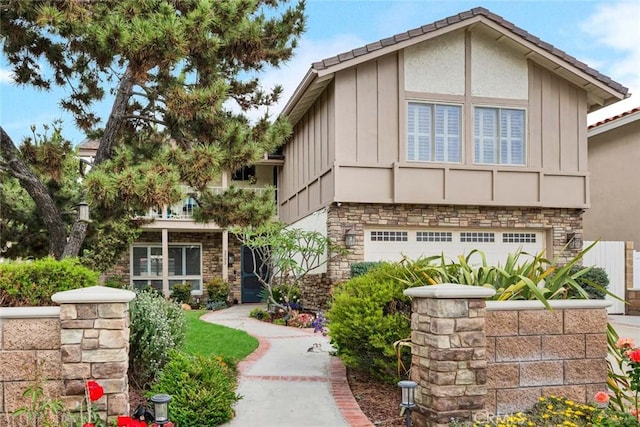 3595 Sego St, Irvine, CA 92606 - view of front facade featuring stone siding, board and batten siding, a garage, and stucco siding