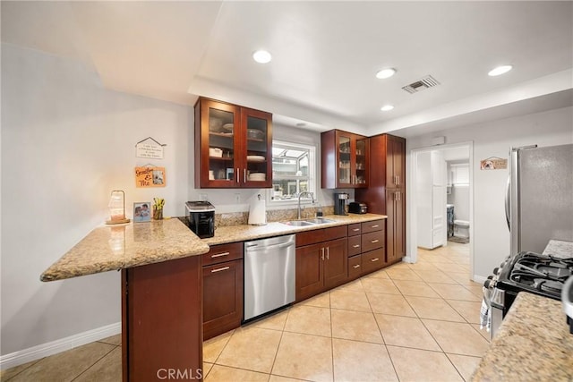 22353 Roscoe Blvd, West Hills, CA 91304 - kitchen featuring appliances with stainless steel finishes, a sink, light tile patterned floors, recessed lighting, and glass insert cabinets