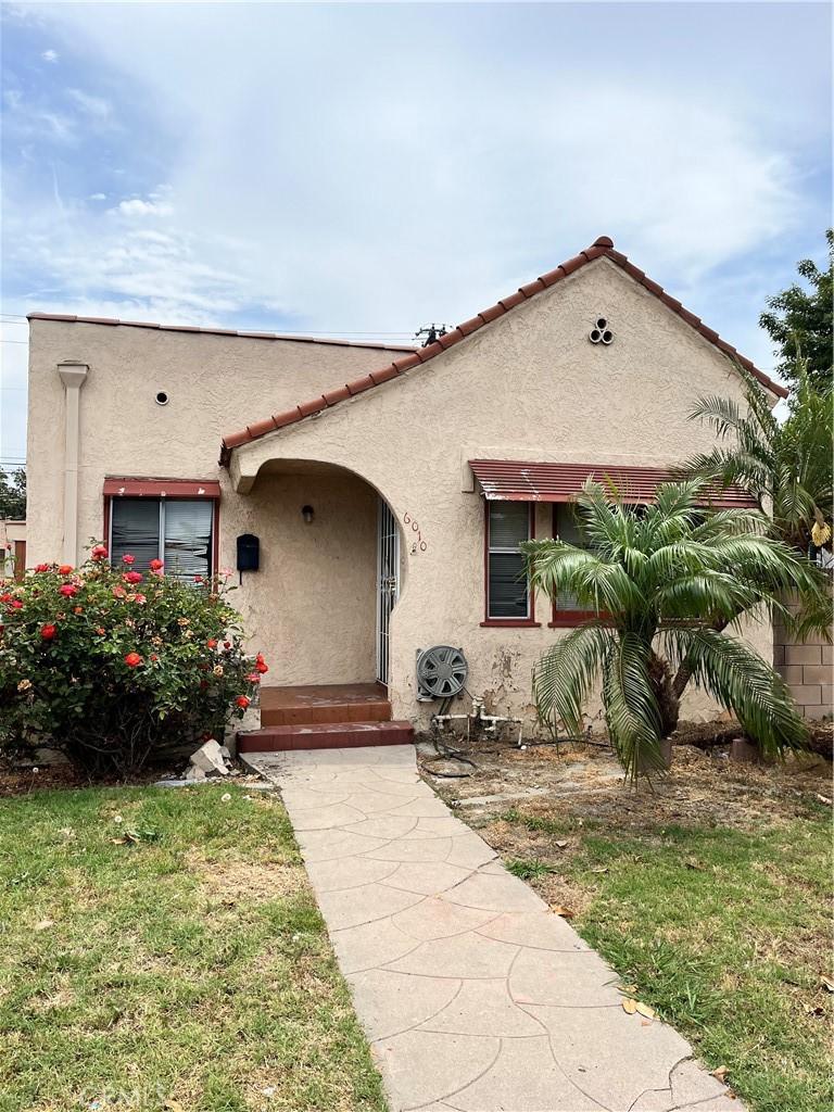 6010 Linden Ave, Long Beach, CA 90805 - mediterranean / spanish home with stucco siding and a front lawn