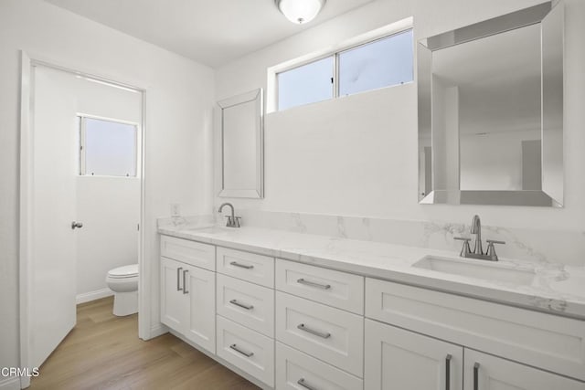 196 Mariposa Dr, Camarillo, CA 93012 - full bathroom with toilet, double vanity, and wood finished floors
