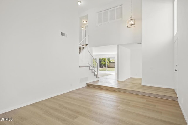 196 Mariposa Dr, Camarillo, CA 93012 - foyer with a high ceiling, stairs, light wood-type flooring, baseboards, and a chandelier