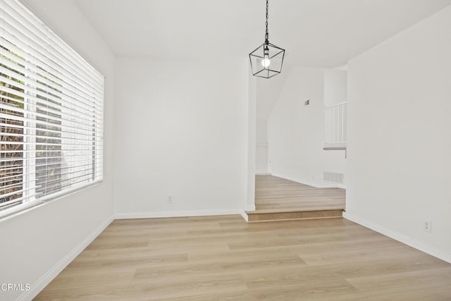 196 Mariposa Dr, Camarillo, CA 93012 - unfurnished dining area with light wood-style floors and baseboards