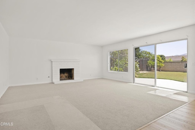 196 Mariposa Dr, Camarillo, CA 93012 - unfurnished living room featuring baseboards, a fireplace, and wood finished floors