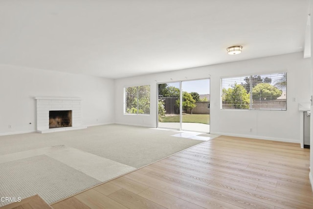 196 Mariposa Dr, Camarillo, CA 93012 - unfurnished living room featuring wood finished floors, baseboards, and a fireplace