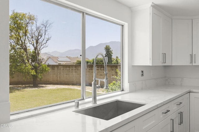 196 Mariposa Dr, Camarillo, CA 93012 - kitchen with a sink, a mountain view, plenty of natural light, and white cabinetry