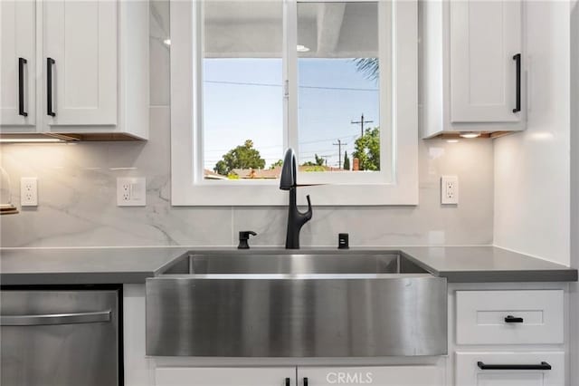 1715 E Redwood Ave, Anaheim, CA 92805 - kitchen with a sink, dishwasher, white cabinetry, and decorative backsplash