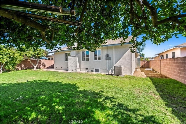 1715 E Redwood Ave, Anaheim, CA 92805 - back of property featuring stucco siding, cooling unit, and crawl space