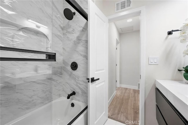 1715 E Redwood Ave, Anaheim, CA 92805 - bathroom with shower / bath combination, vanity, and baseboards