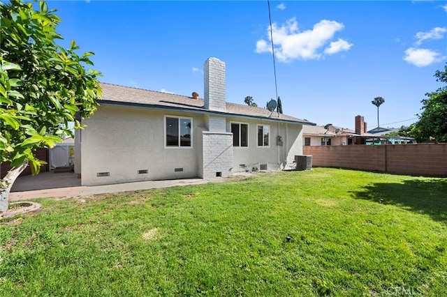 1715 E Redwood Ave, Anaheim, CA 92805 - back of property with crawl space, cooling unit, and a chimney