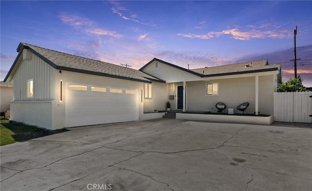 1715 E Redwood Ave, Anaheim, CA 92805 - ranch-style home with a garage, driveway, and stucco siding