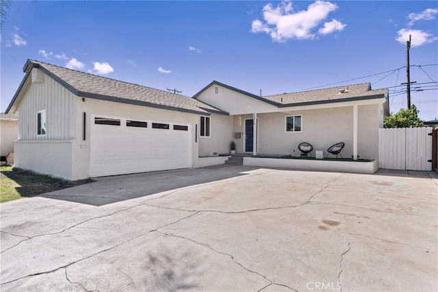 1715 E Redwood Ave, Anaheim, CA 92805 - ranch-style house with a garage, driveway, and stucco siding