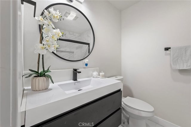 1715 E Redwood Ave, Anaheim, CA 92805 - bathroom featuring vanity, toilet, and baseboards