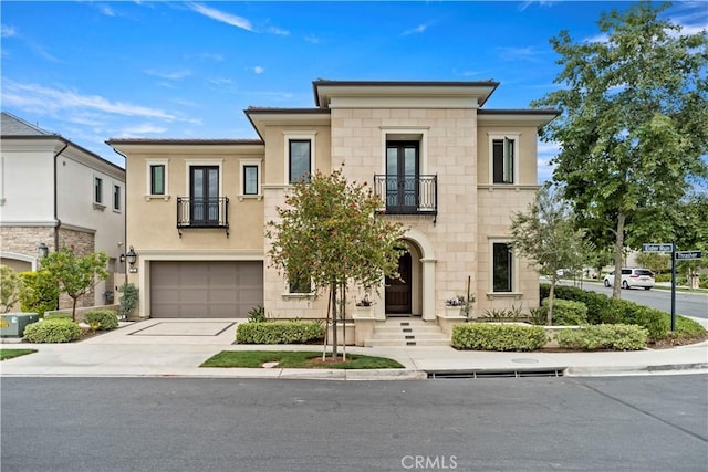 51 Eider Run, Irvine, CA 92618 - view of front facade with a balcony, french doors, concrete driveway, and a garage