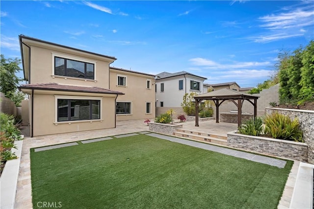 51 Eider Run, Irvine, CA 92618 - back of house with a gazebo, a patio area, stucco siding, and a fenced backyard