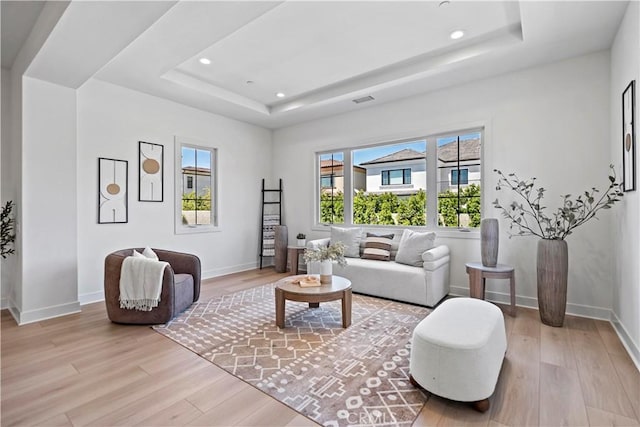 51 Eider Run, Irvine, CA 92618 - living area featuring a tray ceiling, wood finished floors, and recessed lighting