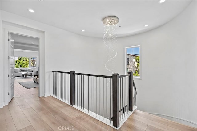 51 Eider Run, Irvine, CA 92618 - corridor featuring an upstairs landing, a chandelier, plenty of natural light, light wood-type flooring, and recessed lighting