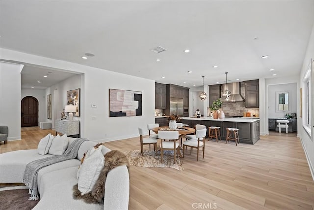 51 Eider Run, Irvine, CA 92618 - living area with recessed lighting, light wood-type flooring, and arched walkways