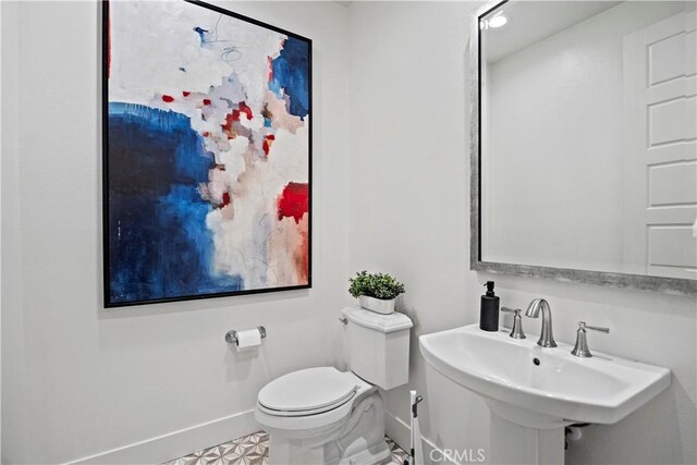 51 Eider Run, Irvine, CA 92618 - half bath featuring baseboards and a sink
