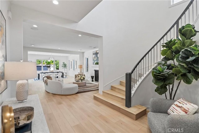 51 Eider Run, Irvine, CA 92618 - entrance foyer featuring stairs, wood finished floors, recessed lighting, and a fireplace