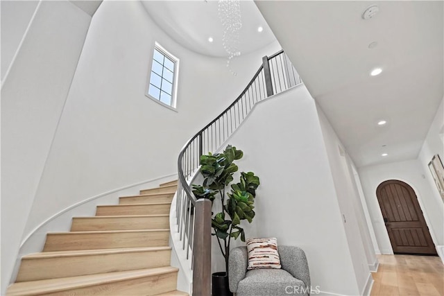 51 Eider Run, Irvine, CA 92618 - stairway with recessed lighting, wood finished floors, a high ceiling, and arched walkways