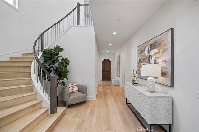 51 Eider Run, Irvine, CA 92618 - entryway featuring recessed lighting, light wood finished floors, stairway, and arched walkways